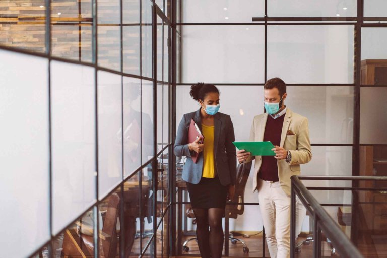 People wearing masks in the office for illness prevention during COVID-19 pandemic